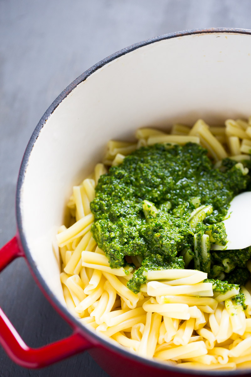 Pot with pasta with classic vegan pesto