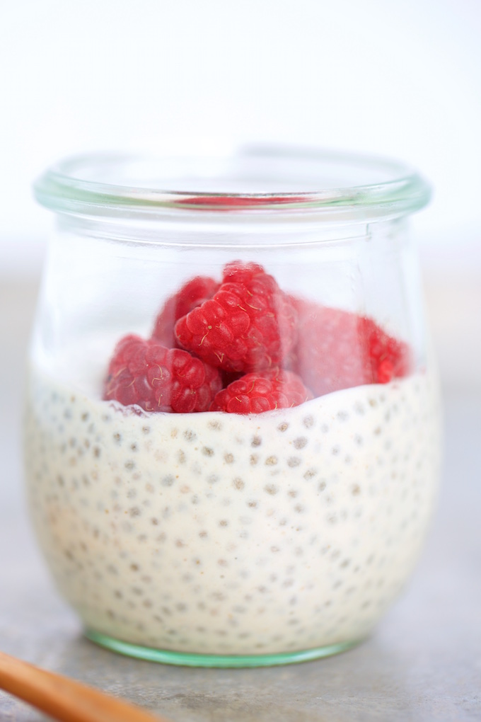 vegan chia pudding in a jar with berries