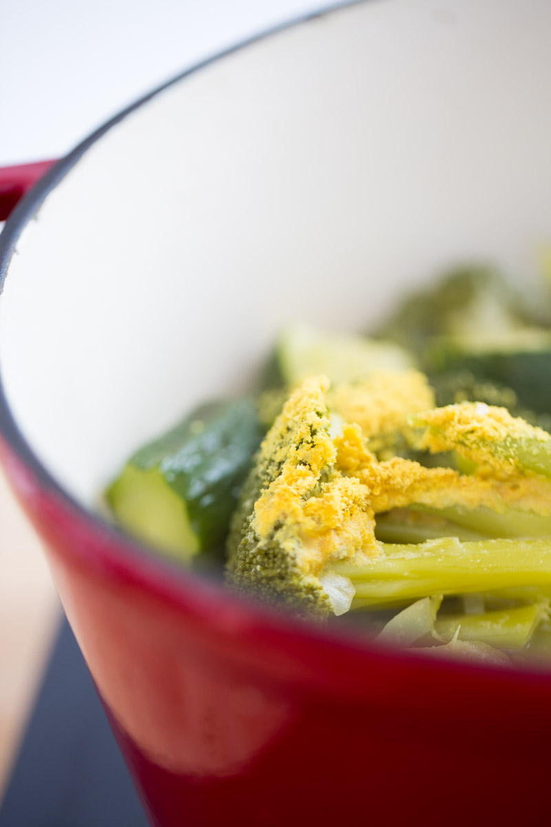 BROCCOLI in a pot covered with salt and nutritional yeast