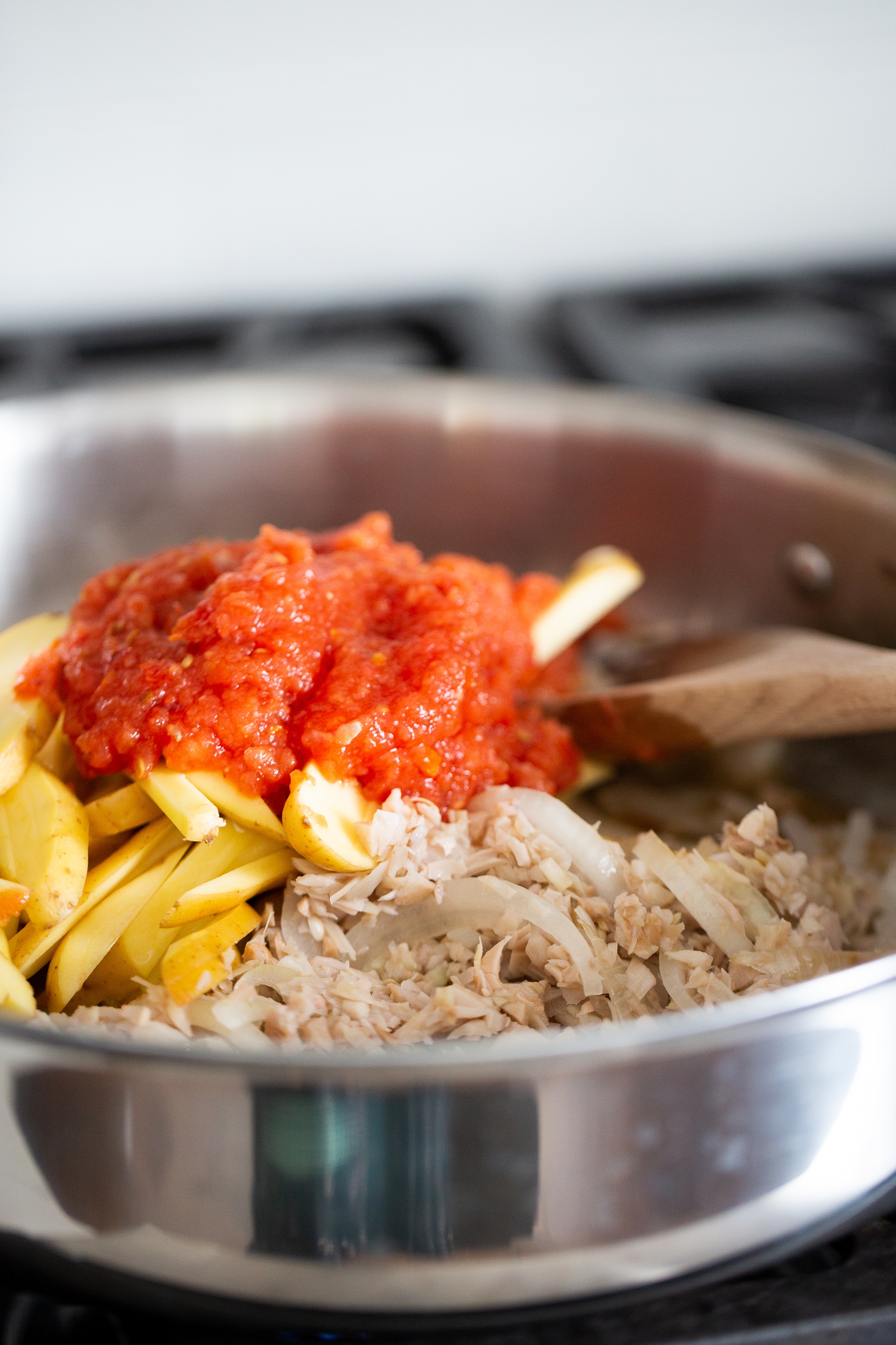 jackfruit, potatoes and smokey tomato chipotle sauce in a stainnless steal skillet