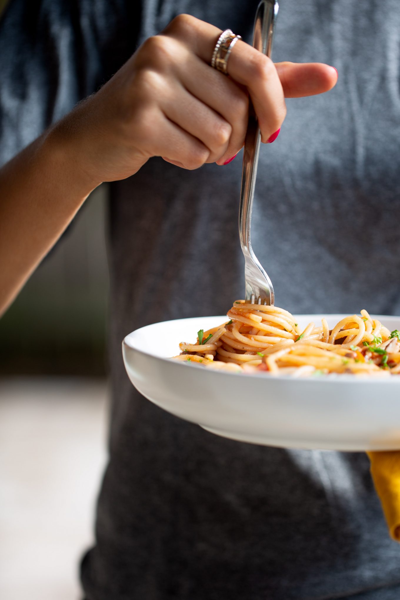 twirling a fork around pasta a la bolognese