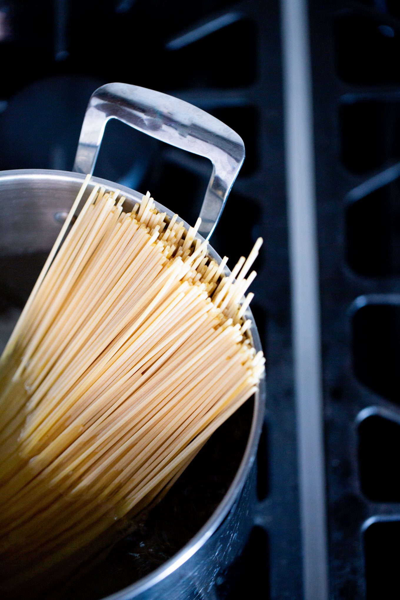 dry pasta in a pot of water