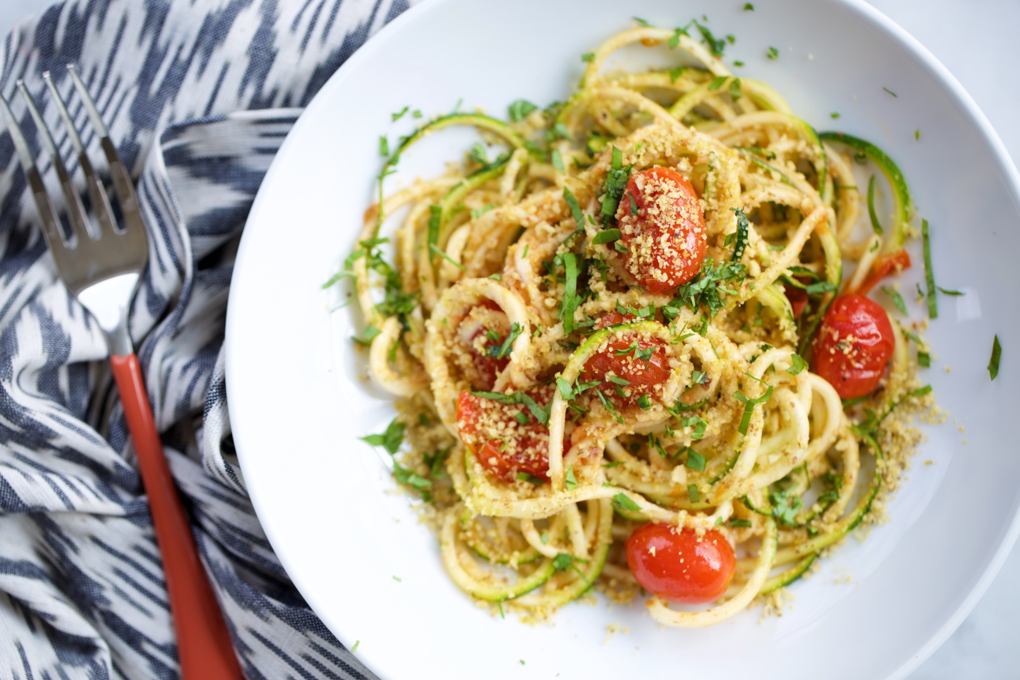 Zucchini Noodles With Roasted Cherry Tomatoes And Vegan Parmesan Zucchini Noodles With Roasted Cherry Tomatoes And Vegan Parmesan