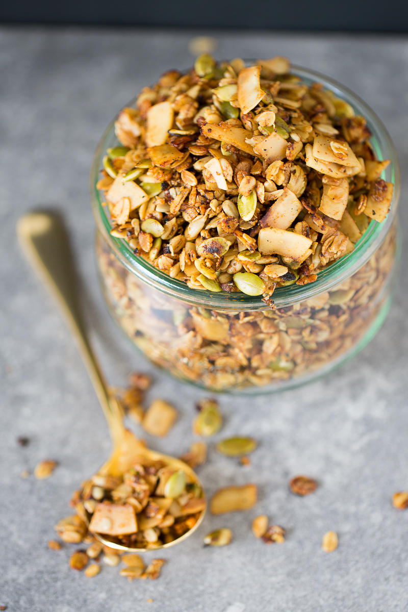 Savory and vegan granola in a glass container.