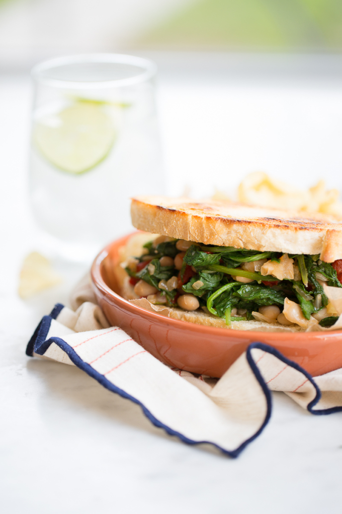 healthy vegan kale sandwich over an orange dish