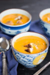Vegan butternut squash soup with vegan grilled cheese sandwich crutons.