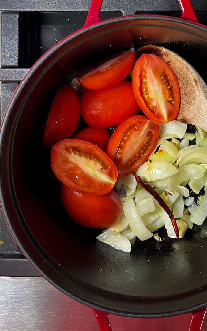 onion, garlic and tomatoes in a dutch oven