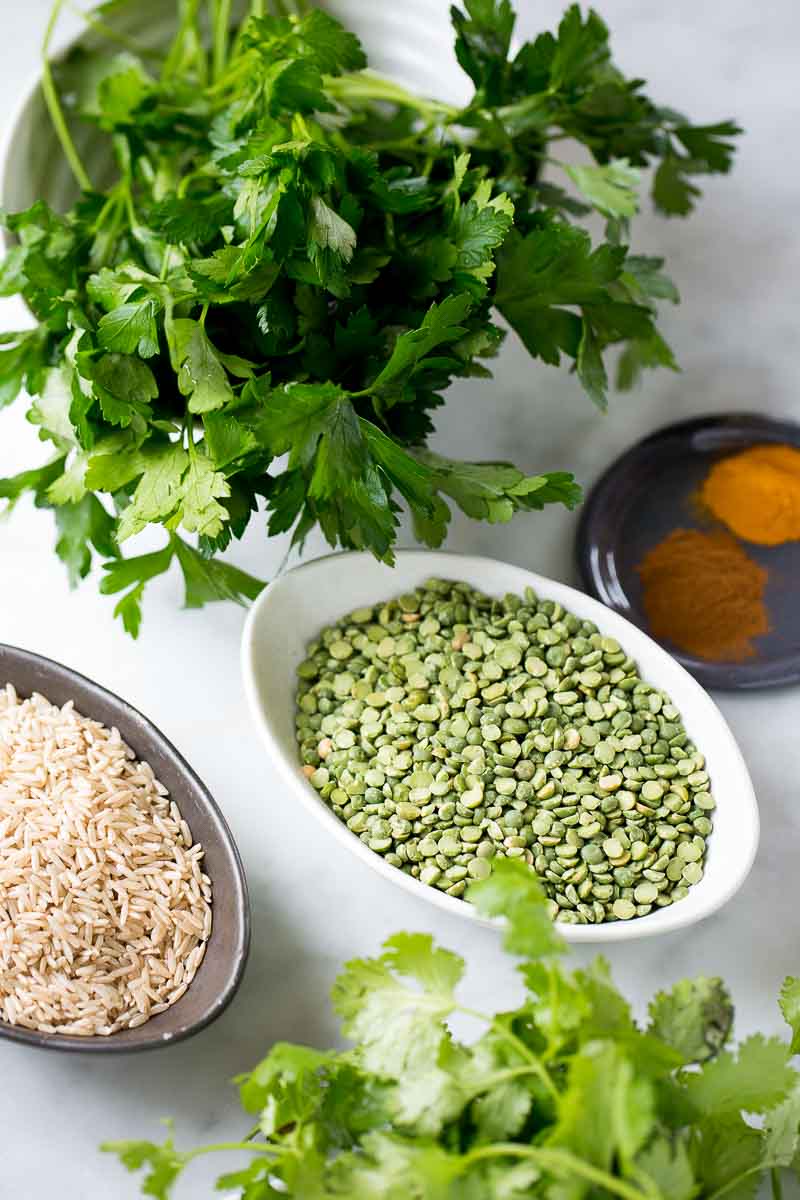 GREEN SPLIT PEA in a bowl, rice, and fresh herbs