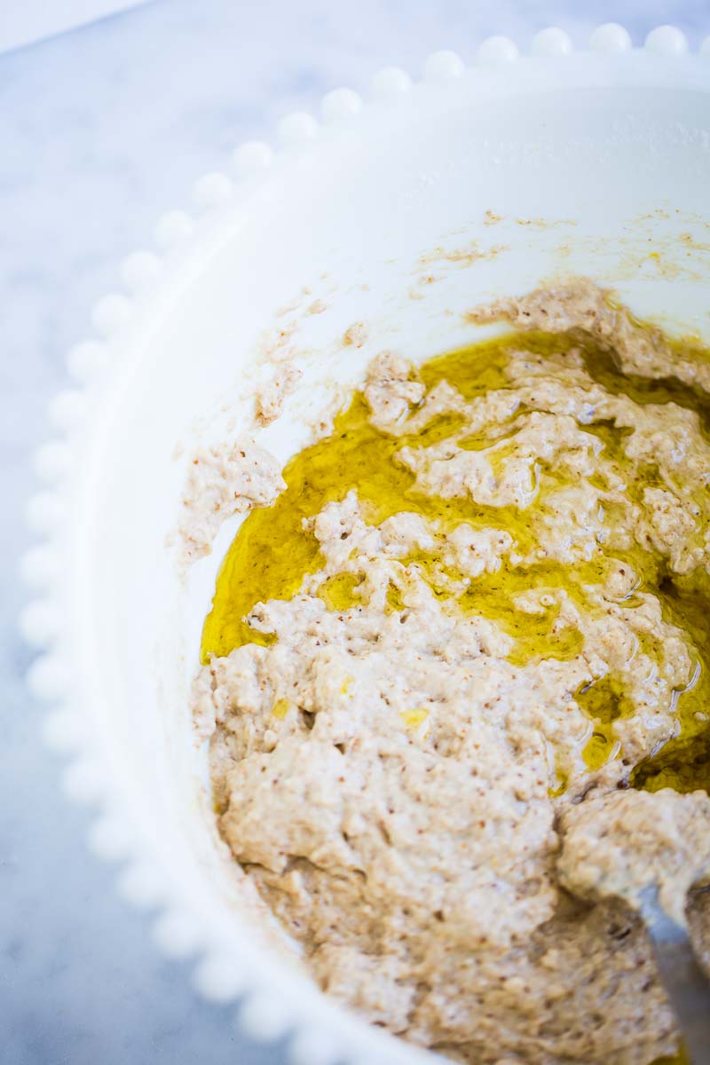 Mixing the olive oil in the vegan loaf batter