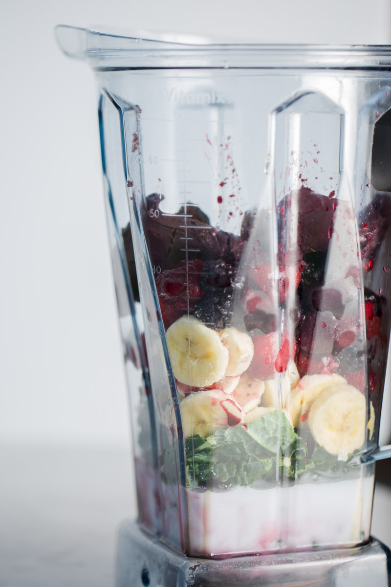 Ingredients for an incredible berries and acai smoothie in the blender