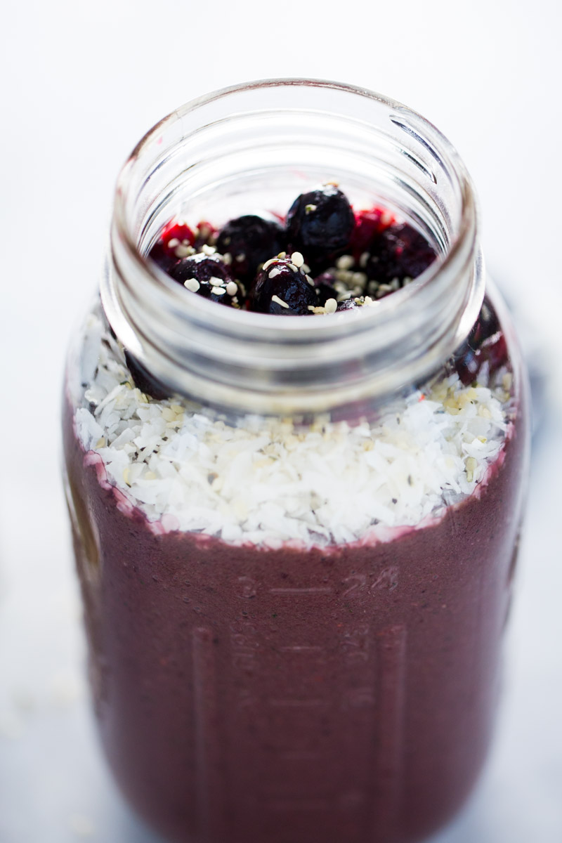 A jar filled with berries and acai
