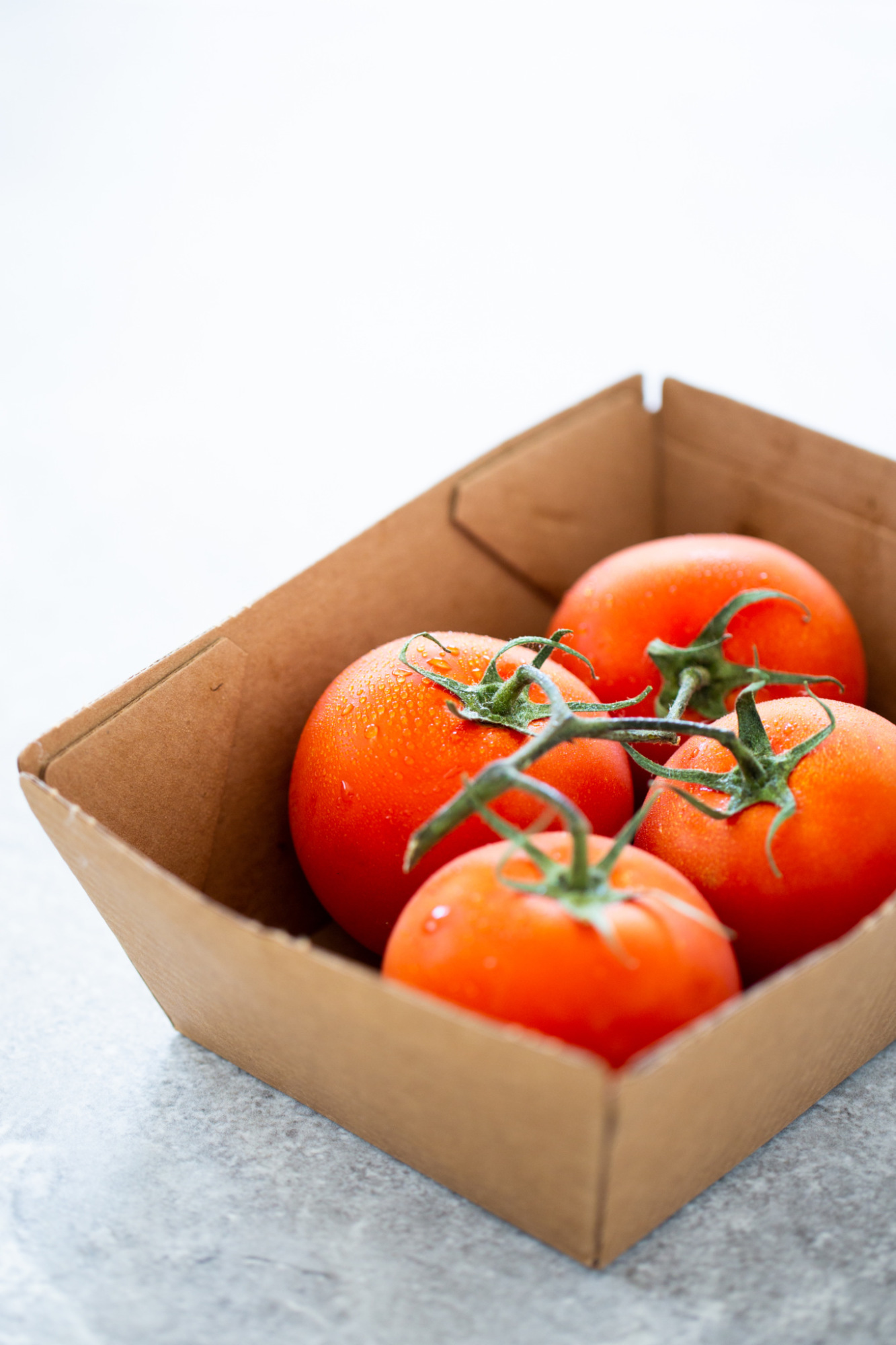 tomatoes in a box for enchilada sauce