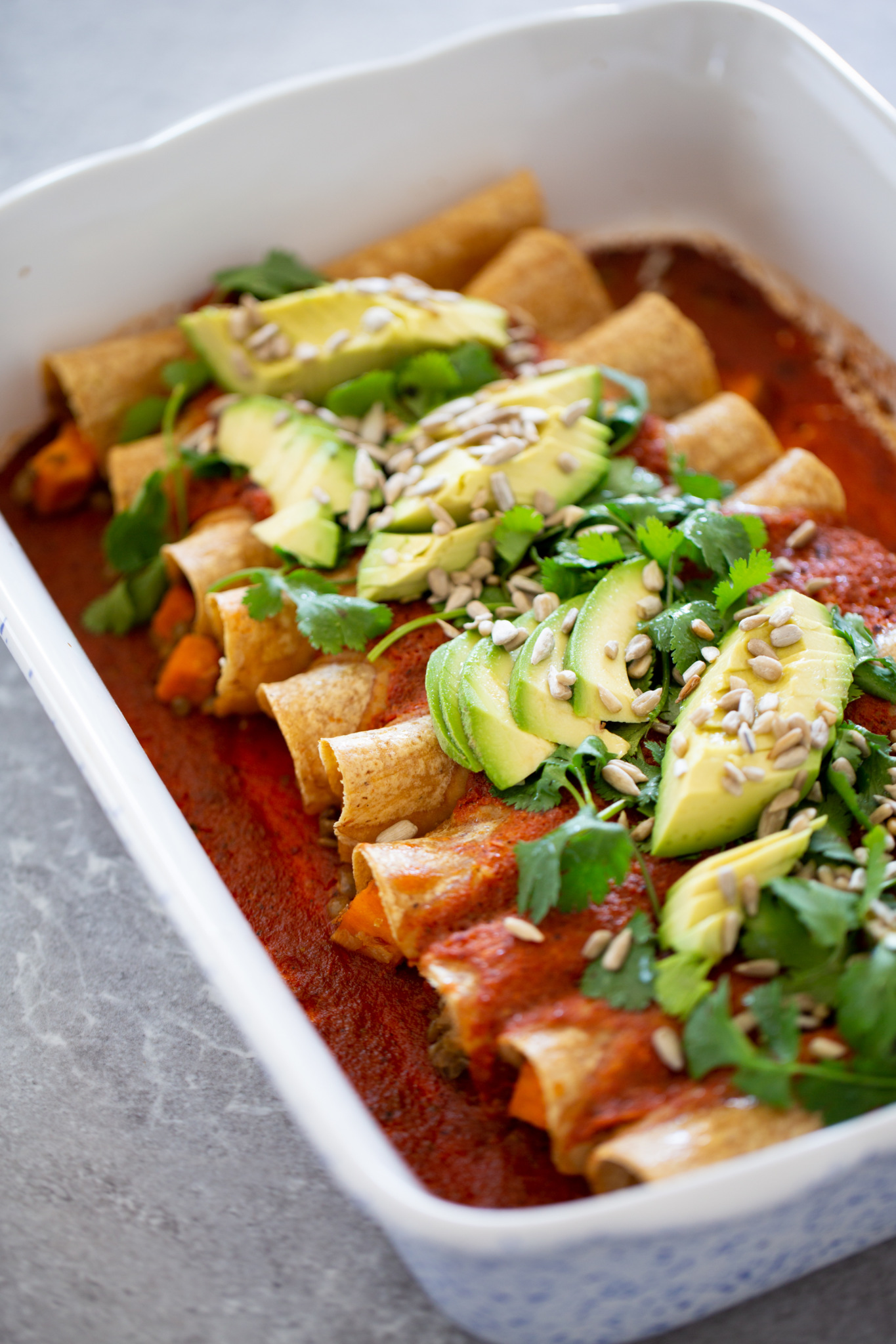 vegan enchiladas filled with lentils and sweet potatotoes