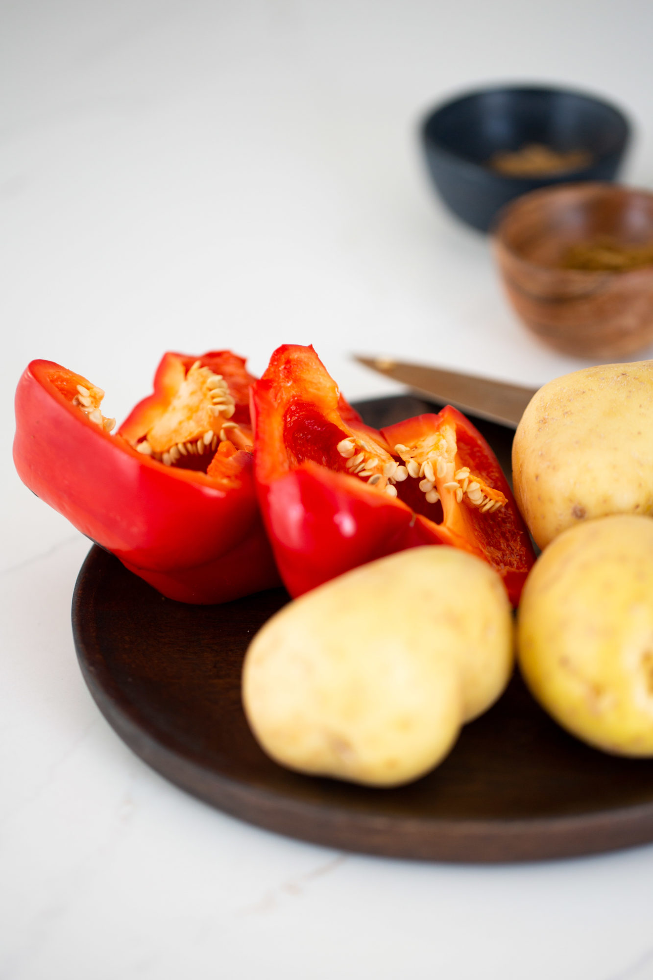 potatoes and red bell pepper cut in half