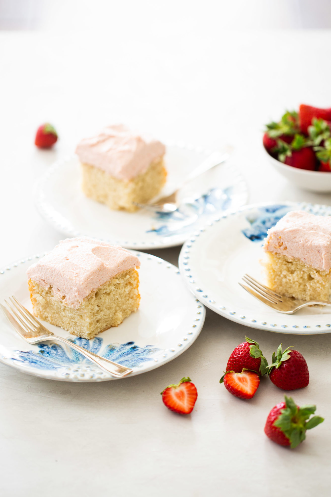 Vanilla cake with light and fluffy strawberry frosting.