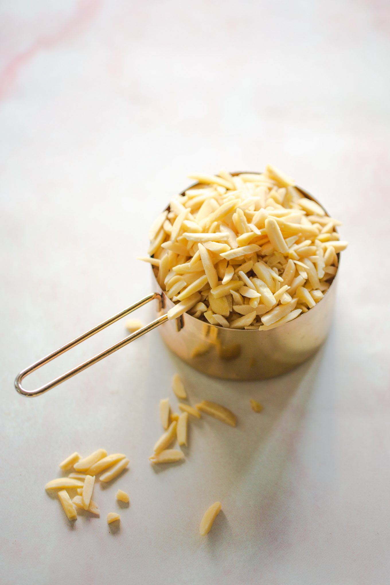 slivered almonds in a measuring cup