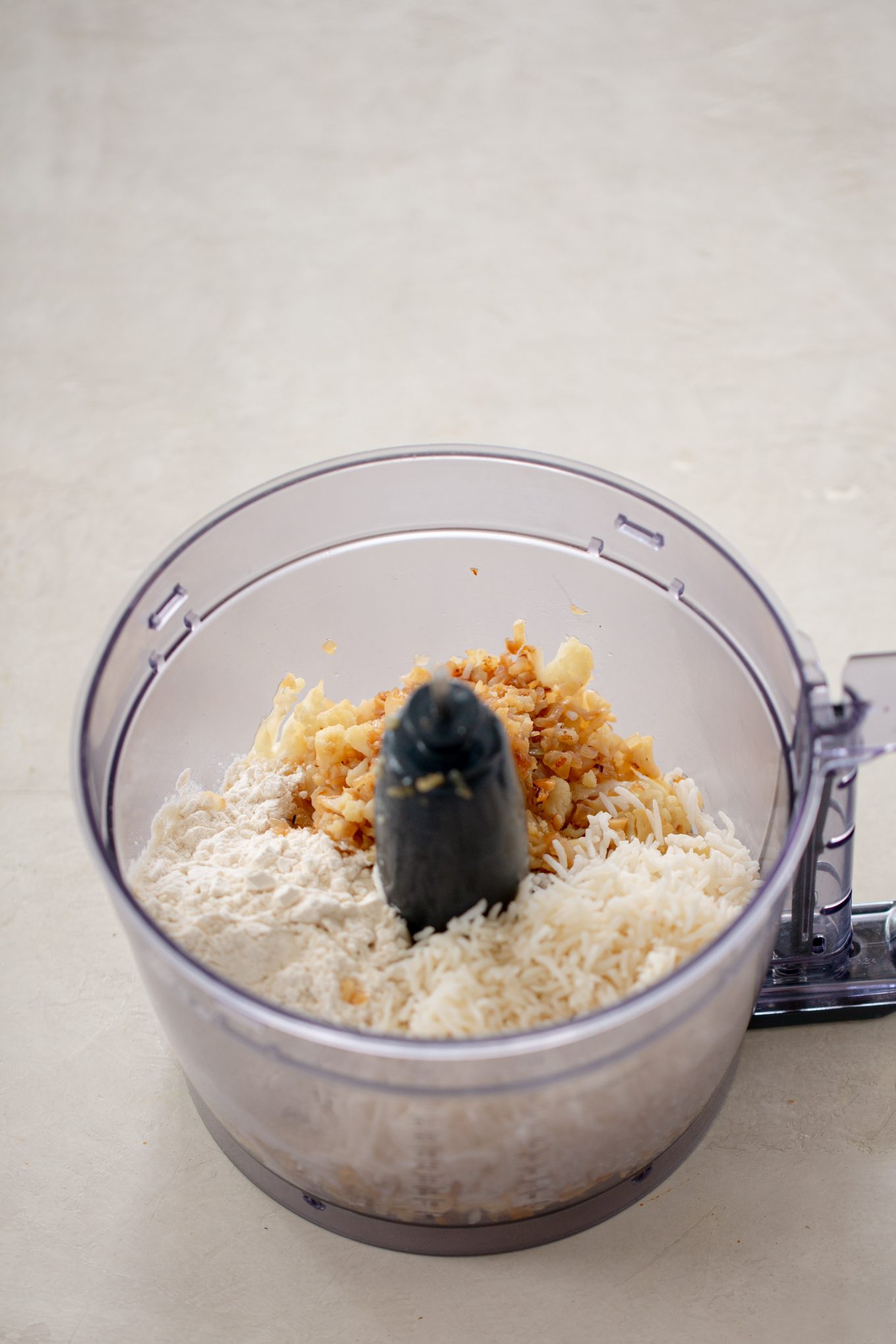 ingredients for vegan meatballs in a food processor container
