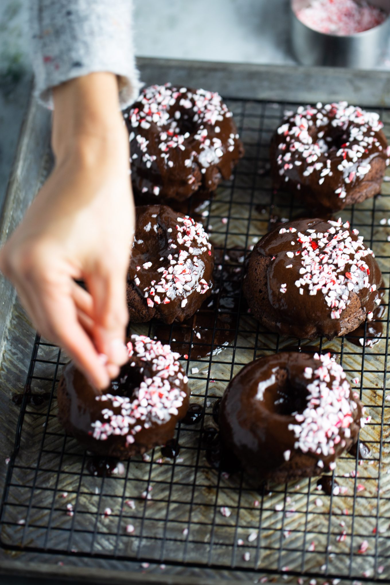 Finishing the vegan doughnuts with mint hard candy