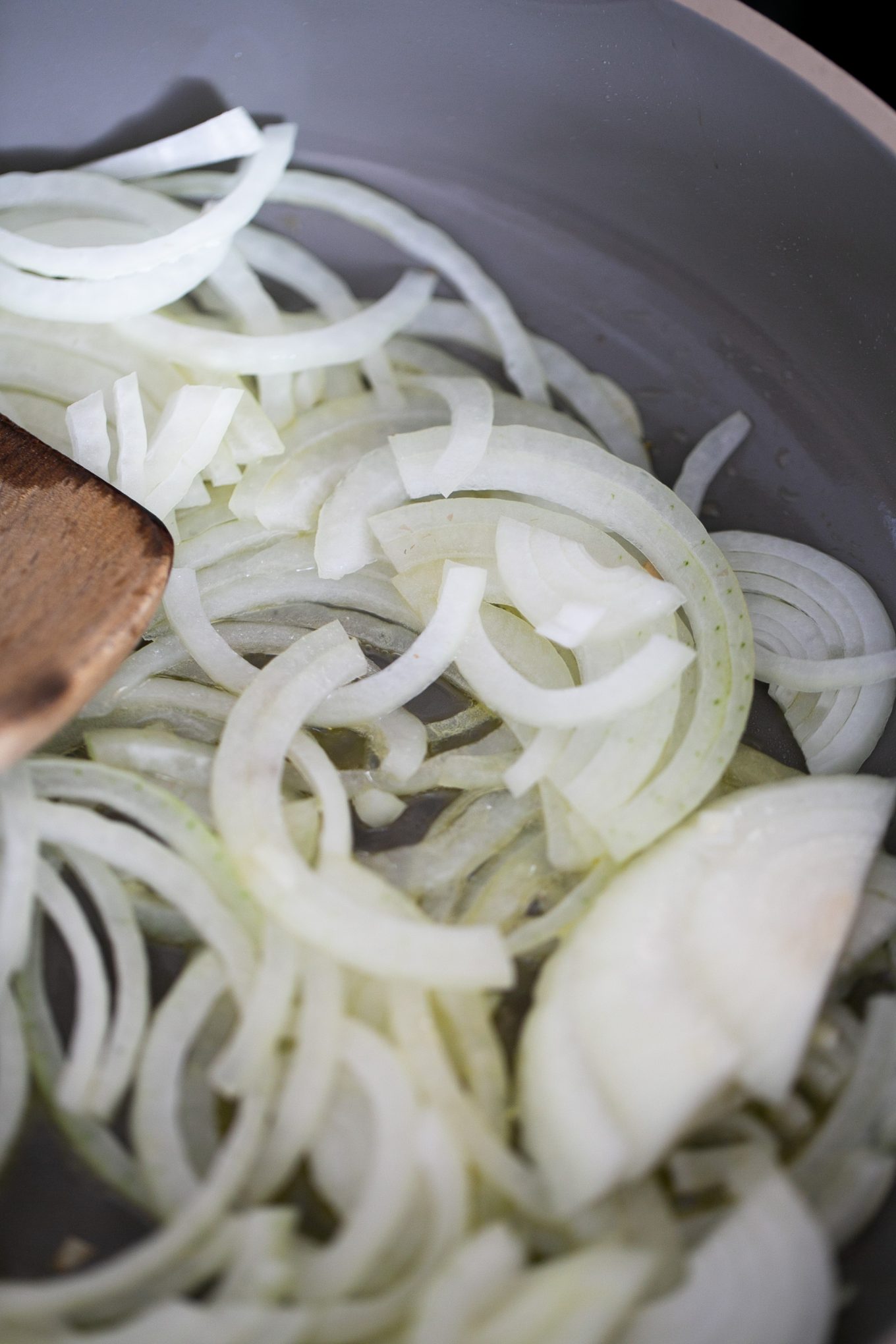 sauteeing onions in a pan