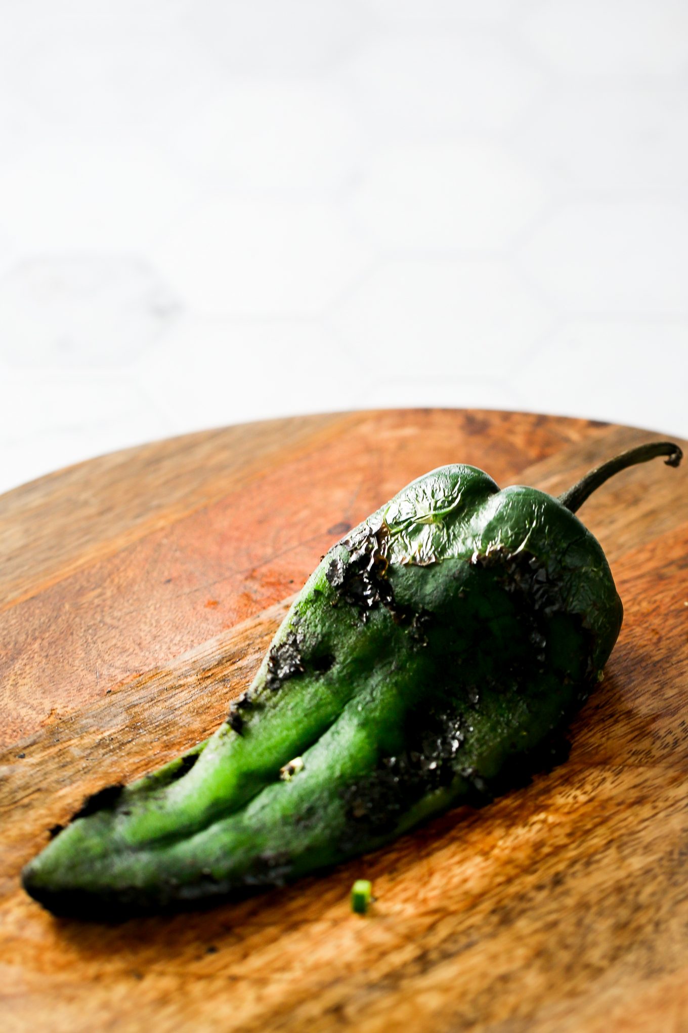 skinned chile poblano on a cutting board