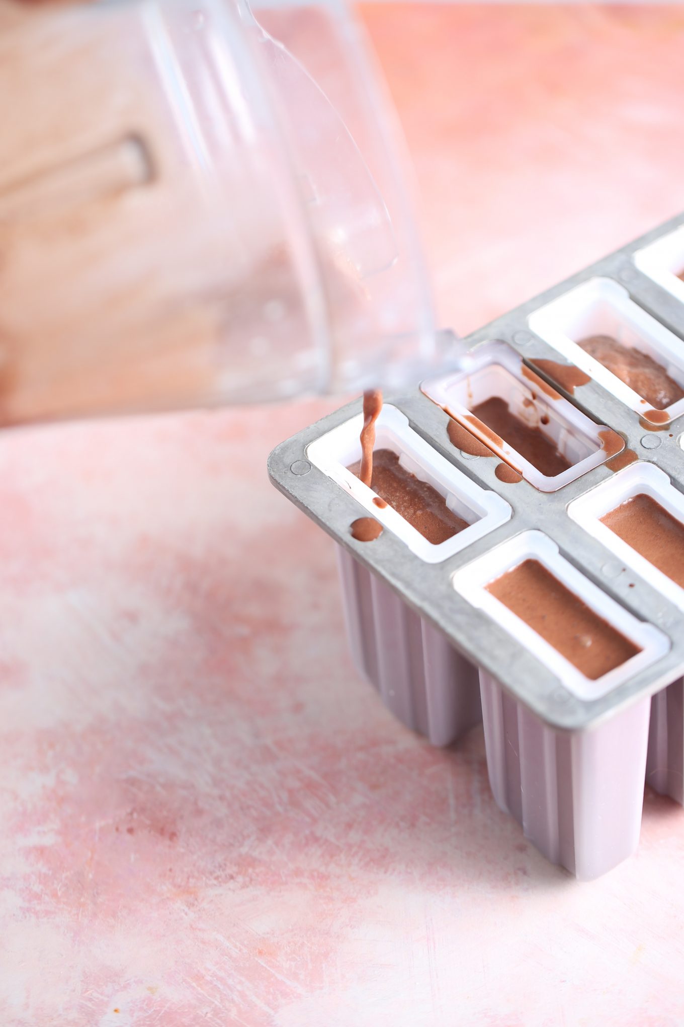 pouring mix into ice pop molds