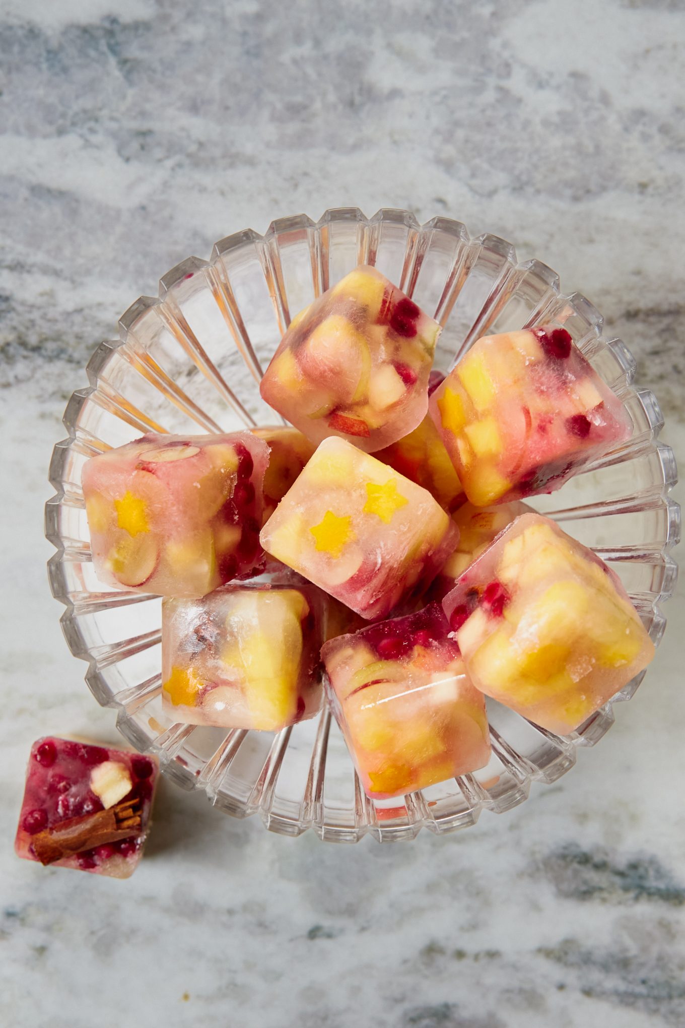 Ice cubes with fruit in a crystal bowl