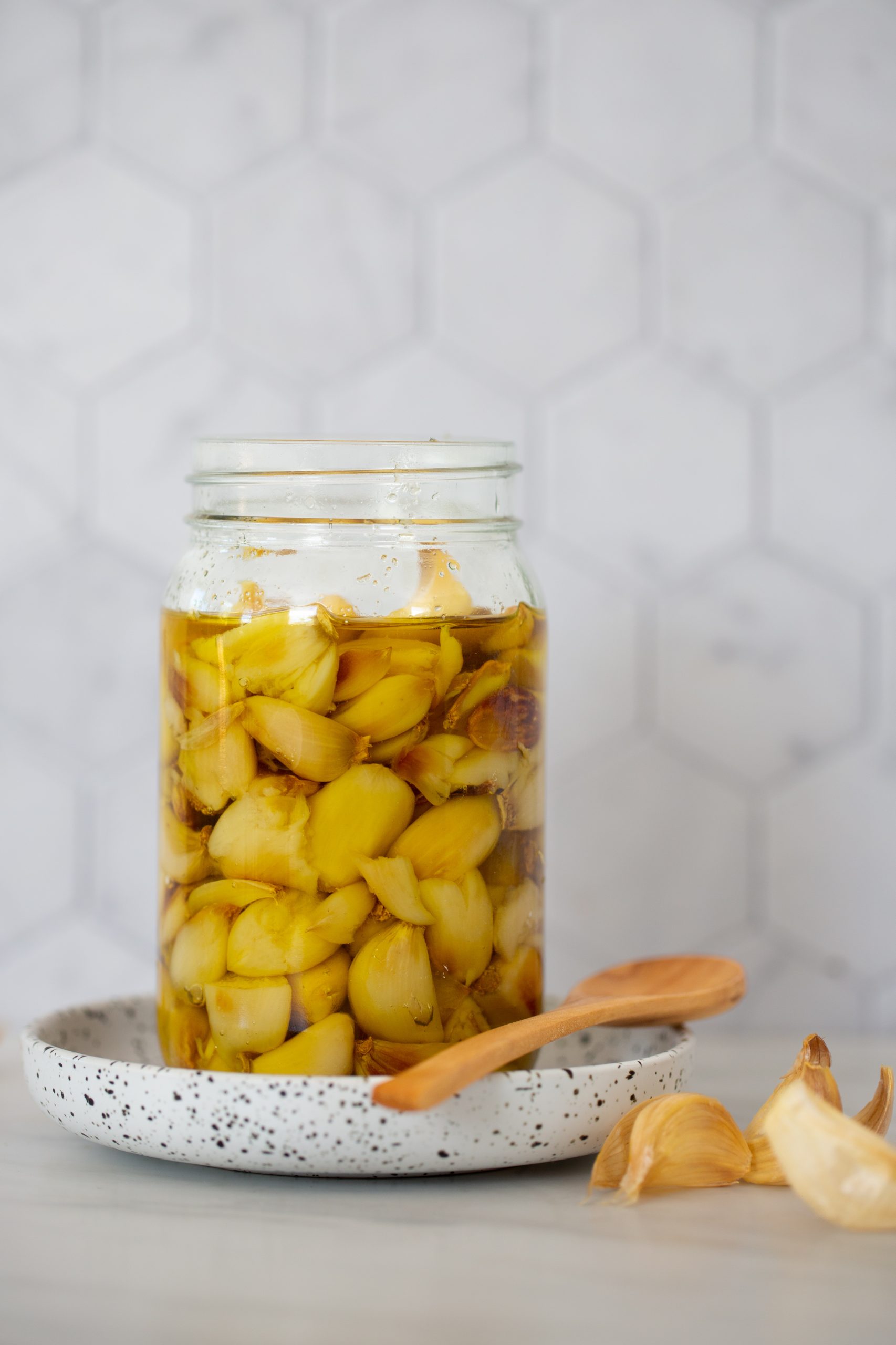 garlic cloves in jar with oil