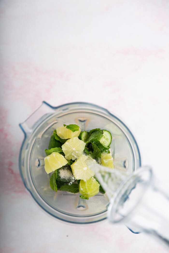limes, mint and cucumbers in the blender