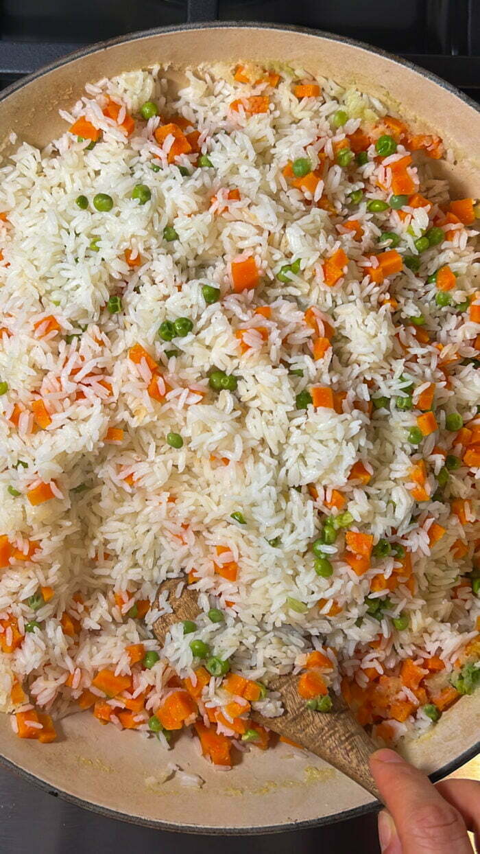 fluffeed mexican arroz blanco with carrots and peas.