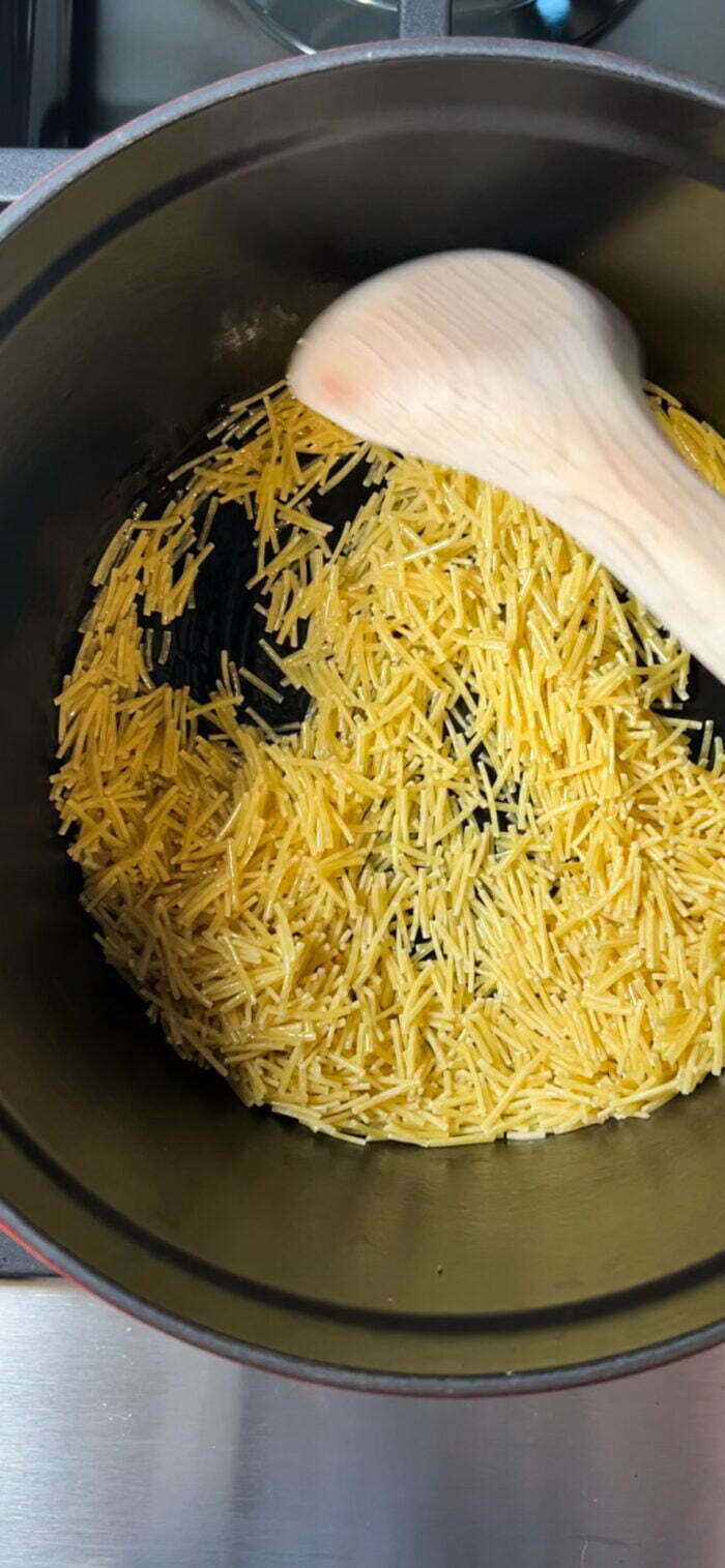 dried fideos in a pan.