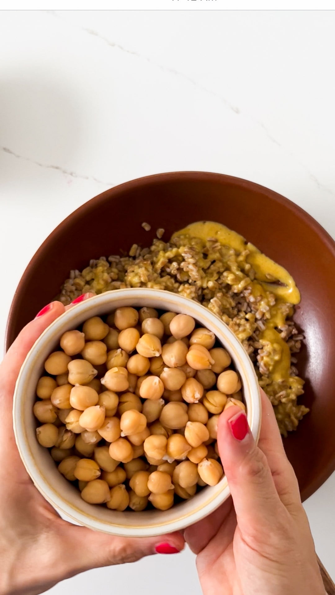 adding canned chickpeas to the curried chickpea salad salad