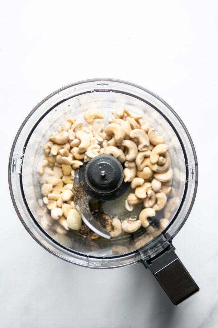 cashews in the bowl of a food processor